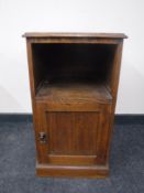 An Edwardian oak pot cupboard