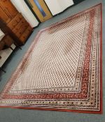 A machine made carpet of Persian design,