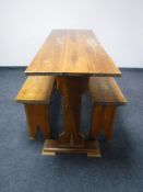 A pine refectory kitchen table together with two benches