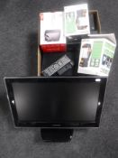 A box containing a desk top hard drive, two outdoor camping lights, Panasonic HD box,
