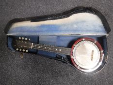 A mandolin banjo with original case, British made circa 1930.