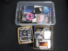 Three boxes containing assorted DVD's and CD's