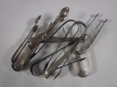 Eight pairs of Georgian silver sugar tongs,