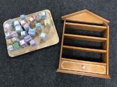 A wooden spice rack together with a set of twenty-four Spice Village spice pots