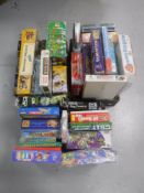 Three boxes containing assorted board games and toys
