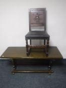 A carved oak panel back dining chair together with an oak refectory coffee table