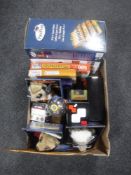 A box containing games compendium, jigsaws, boomerang,