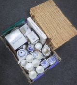 A box containing assorted boxed and unboxed Ringtons china together with a wicker hamper