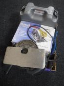 A box containing two circular saws with extra blades,