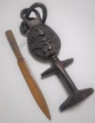 An Ashanti tribal fertility carving together with a carved wooden letter opener