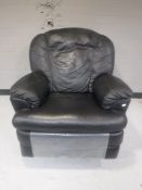 A black leather manual reclining armchair