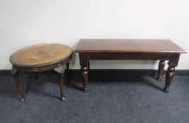 A pine bench together with a circular walnut coffee table