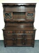 An oak triple door dresser