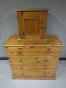 A pine four drawer chest together with a pine bedside cabinet