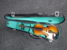 A small child's 1/4 size violin with shaped case and bows, maker Lark.
