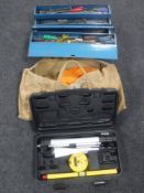 A metal concertina tool box containing a large quantity of hand tools together with a canvas bag