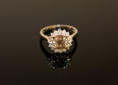 A 14ct white gold diamond cluster ring,