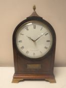A 20th century inlaid mahogany mantel clock with lion mask handles by Comitti of London on brass