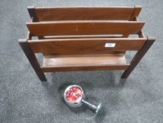 A mid 20th century Danish teak magazine rack together with a Coral two jewels desk clock