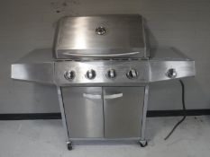 A five burner gas BBQ in a stainless steel finish