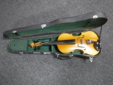 A full size violin with shaped case and bow