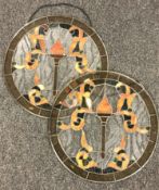 Two circular stained glass panels