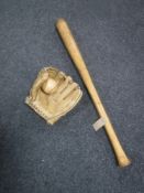 A wooden Worth Robinson baseball bat together with a leather Regent pro model catchers mitt and a
