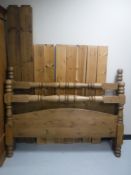 A contemporary pine 5' bed frame