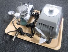 A vintage tattoo artist's compressor together with a AS18 model compressor