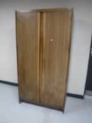 A 20th century teak double door gent's wardrobe