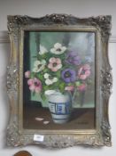 A gilt framed oil on canvas still life, signed C.