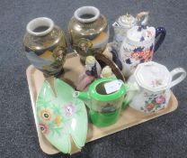 A tray containing antique and later teapots, Carlton ware shallow dish,