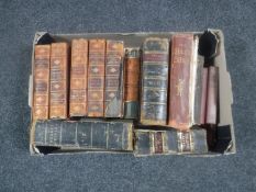 A box containing antiquarian volume including Bibles, Popular Educator,
