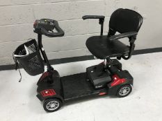 A Drive Scout mobility scooter with keys,