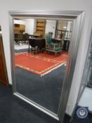 A contemporary silvered framed overmantel mirror