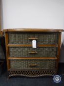 A bamboo and wicker three drawer chest