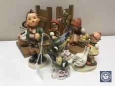 A pair of Hummel bookends, three further Hummel figures - village boy, apple tree girl,