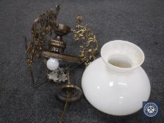 A continental brass light fitting with glass shade