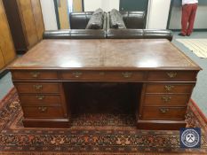 A good quality Georgian style pedestal desk with Burgundy leather top ,