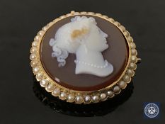 A good quality Victorian stone cameo and pearl brooch, diameter 34 mm.