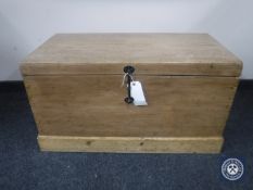 A stripped pine blanket box