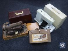 Two mid 20th century electric Singer sewing machines and a vintage Hoover Dustette