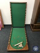 A Victorian mahogany folding table top Bagatelle table and accessories