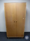 A 20th century teak double door gent's wardrobe