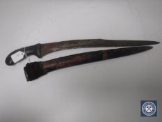 A vintage Eastern knife with curved blade and bamboo handle in bamboo sheath CONDITION