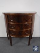 A D-shaped mahogany three drawer chest