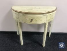 A Chinese demi lune lacquered table fitted a drawer