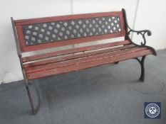 A cast iron and wood garden bench