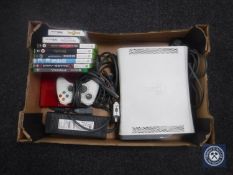 A box of Xbox 360 with games, accessories,