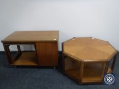 A teak octagonal coffee table and a teak turnover top coffee table fitted table beneath